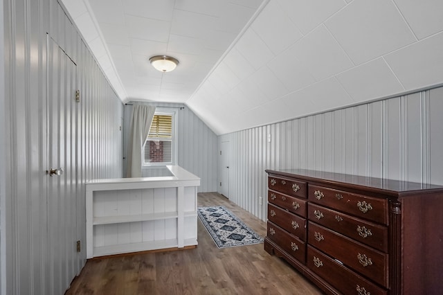 bonus room with lofted ceiling and wood finished floors