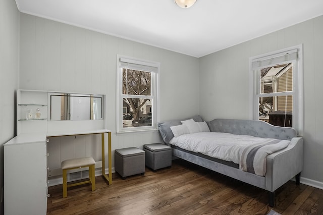 bedroom featuring dark wood finished floors