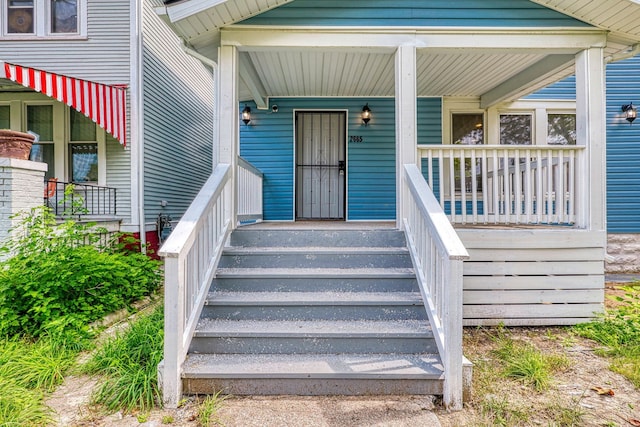 doorway to property with covered porch