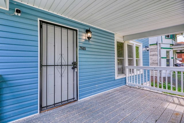 doorway to property featuring a porch