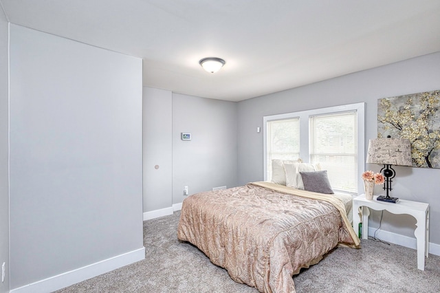 carpeted bedroom with baseboards