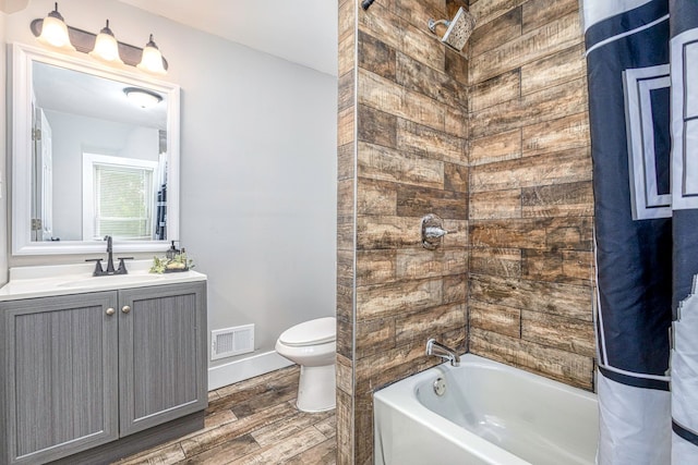 full bathroom featuring visible vents, toilet, shower / tub combo with curtain, wood finished floors, and vanity