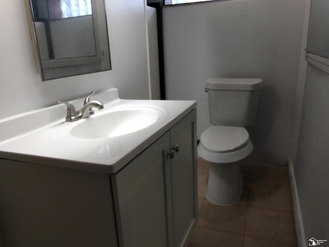 bathroom featuring vanity, toilet, and tile patterned floors