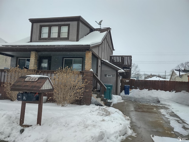 view of front of house featuring fence