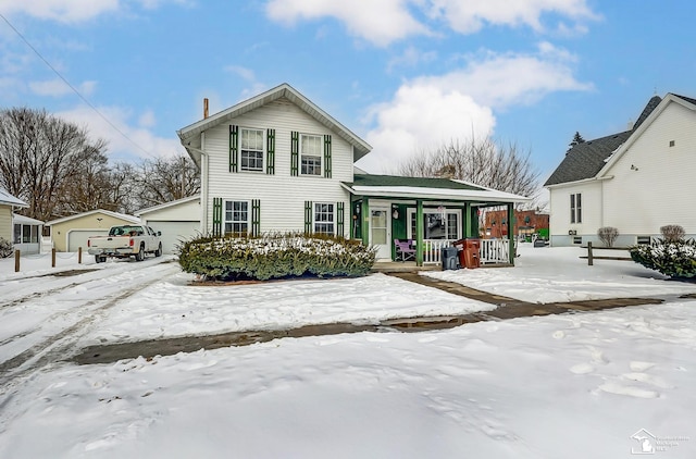 view of front of house with a garage and covered porch