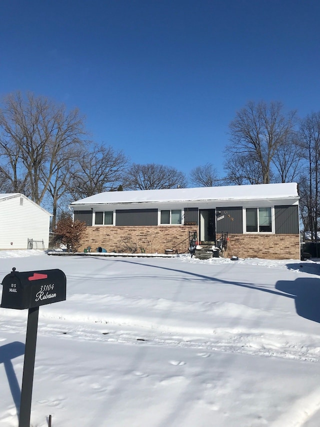 view of front of property featuring brick siding