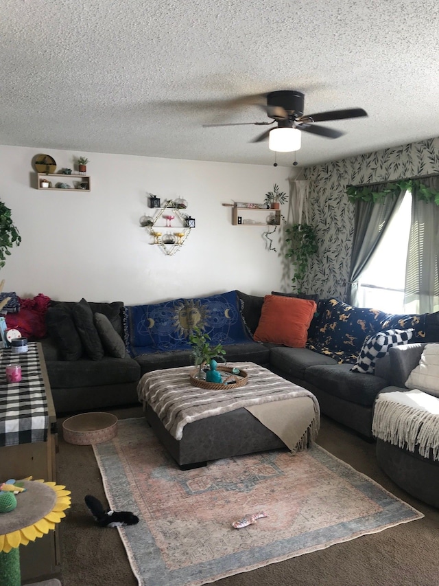 carpeted living area featuring a textured ceiling and ceiling fan