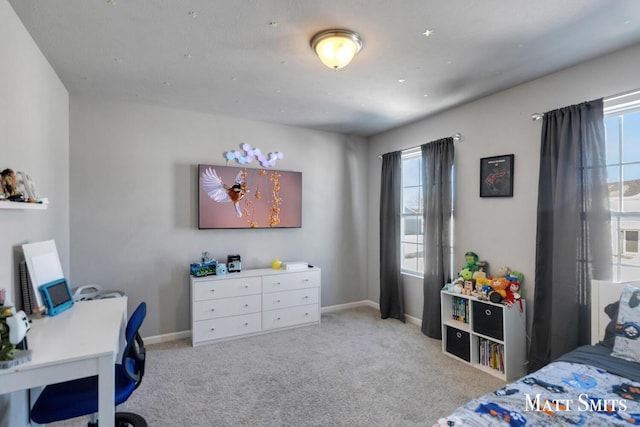 bedroom with light carpet, baseboards, and multiple windows