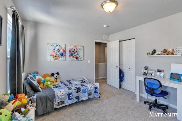 bedroom featuring light carpet, baseboards, visible vents, and a closet