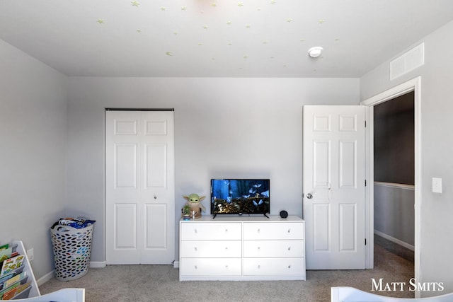 bedroom featuring light carpet, baseboards, and visible vents