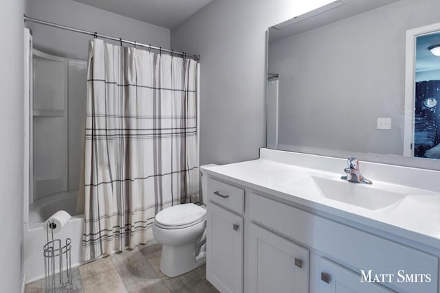 full bathroom with toilet, vanity, and shower / bathtub combination with curtain