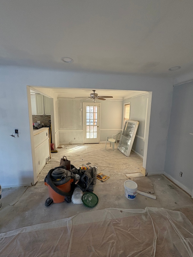 unfurnished living room with a ceiling fan