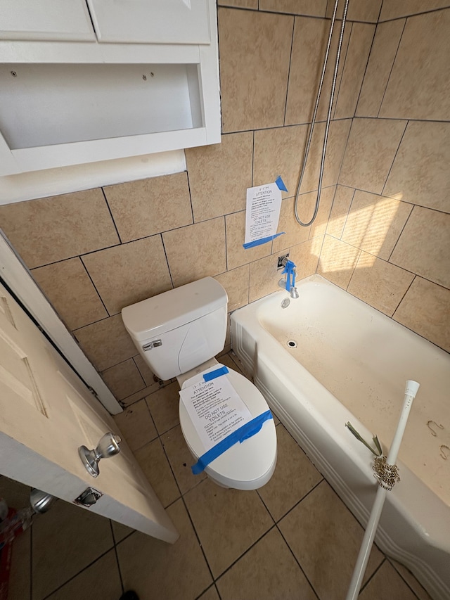 full bathroom featuring shower / bath combination, tile walls, toilet, and tile patterned floors