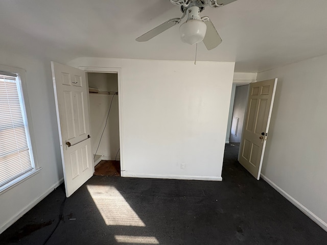 unfurnished bedroom with baseboards and a ceiling fan