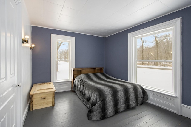 bedroom with dark wood-style floors