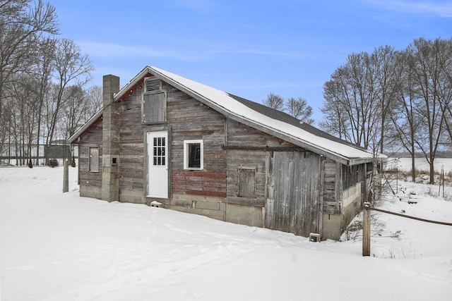 exterior space featuring a barn and an outbuilding