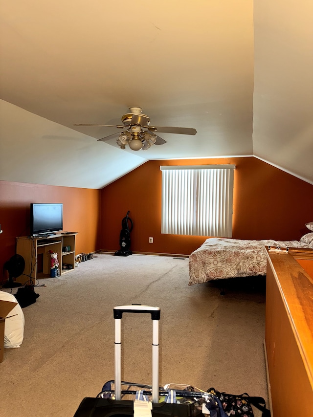 bedroom with carpet flooring, vaulted ceiling, and ceiling fan