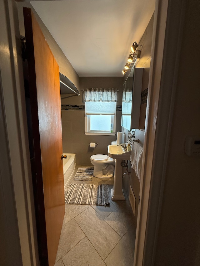 full bathroom featuring toilet, bathtub / shower combination, visible vents, and tile patterned floors