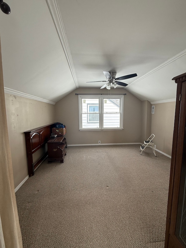 additional living space with carpet floors, vaulted ceiling, baseboards, and a ceiling fan