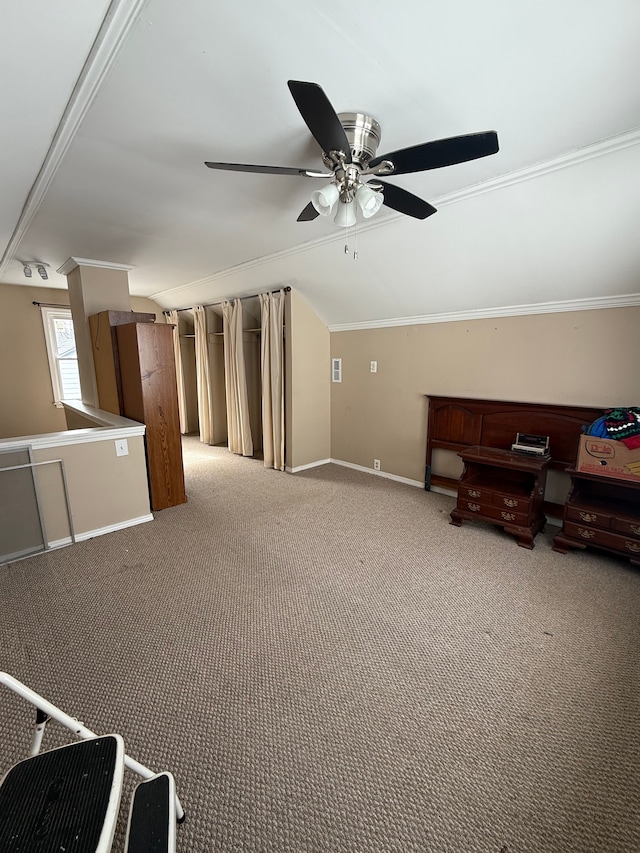 unfurnished living room featuring light carpet, baseboards, a ceiling fan, lofted ceiling, and ornamental molding