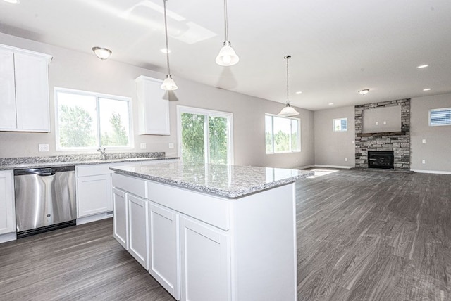 kitchen featuring white cabinetry, pendant lighting, and dishwasher