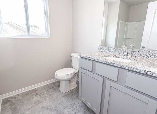 full bathroom with toilet, baseboards, walk in shower, and vanity