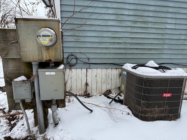 details featuring electric meter and central air condition unit