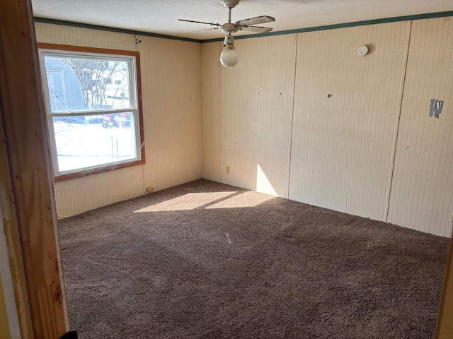 unfurnished room with carpet and ceiling fan