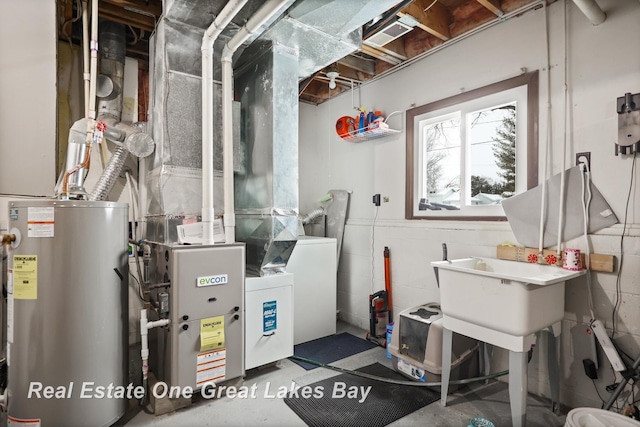 utility room featuring heating unit and water heater