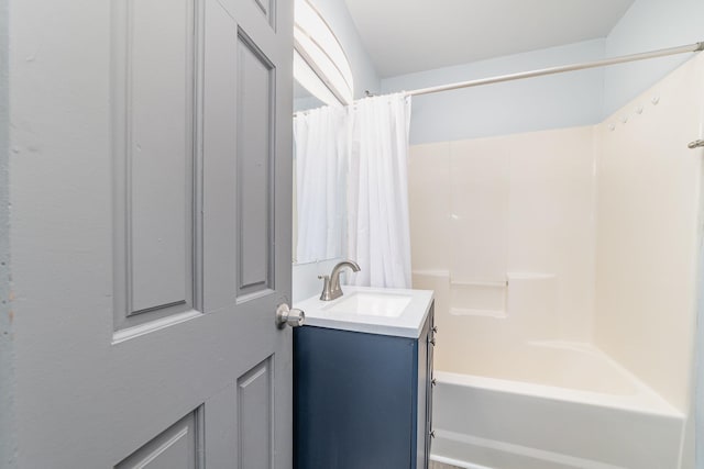 full bath featuring shower / bath combo with shower curtain and vanity