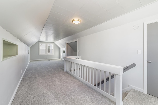 bonus room with carpet, vaulted ceiling, and baseboards