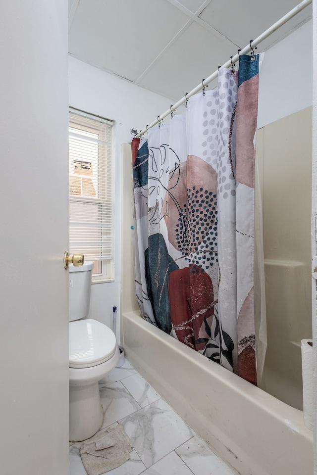 full bath featuring toilet, marble finish floor, and shower / bath combo