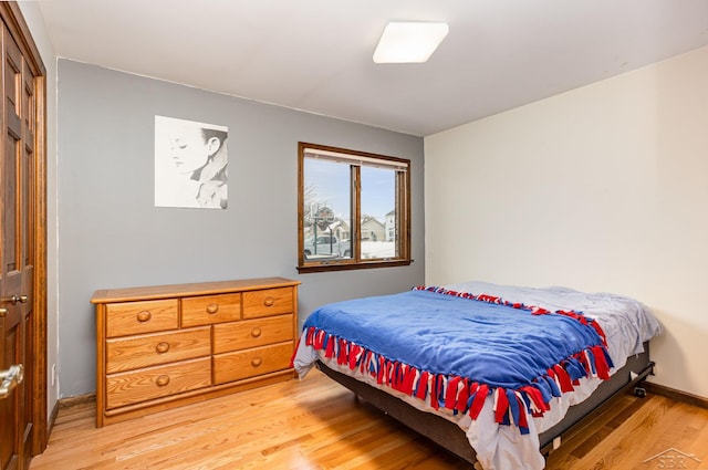 bedroom featuring light wood finished floors