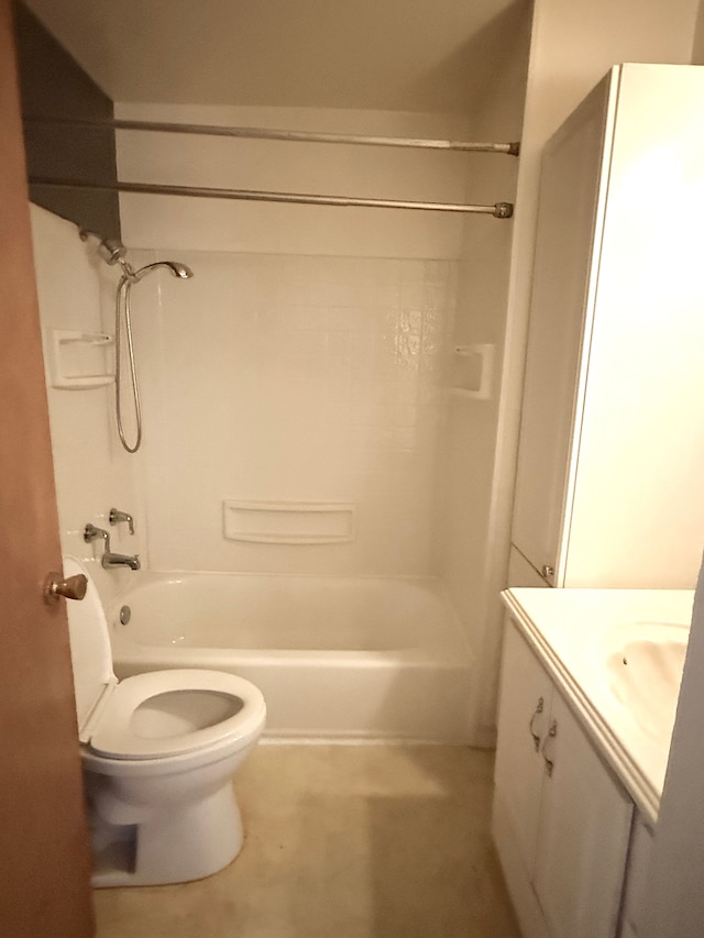 bathroom with tub / shower combination, vanity, and toilet