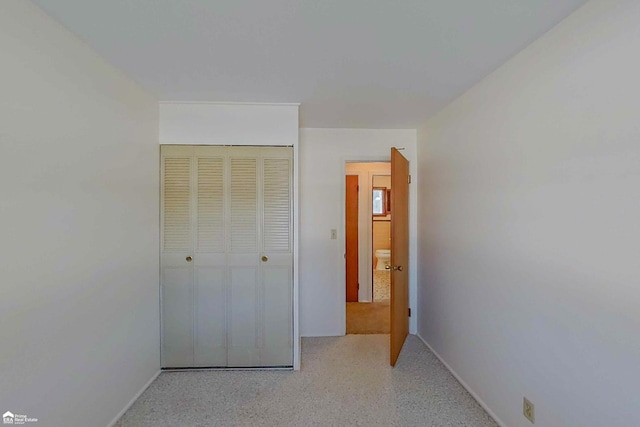 unfurnished bedroom featuring a closet