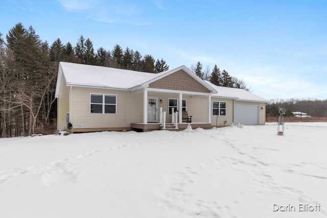 view of front of property featuring covered porch and an attached garage