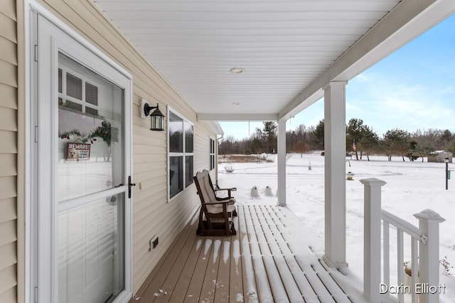 view of snow covered deck