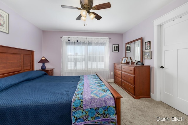 bedroom with baseboards, a ceiling fan, and light colored carpet