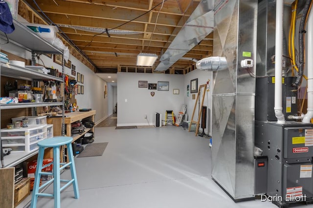 unfinished basement featuring heating unit and a workshop area