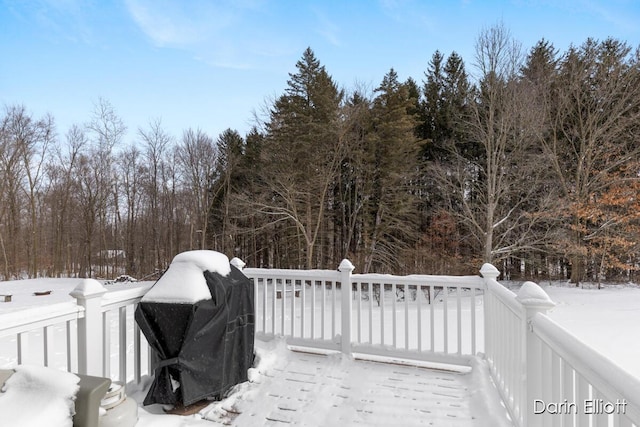 snow covered deck featuring area for grilling