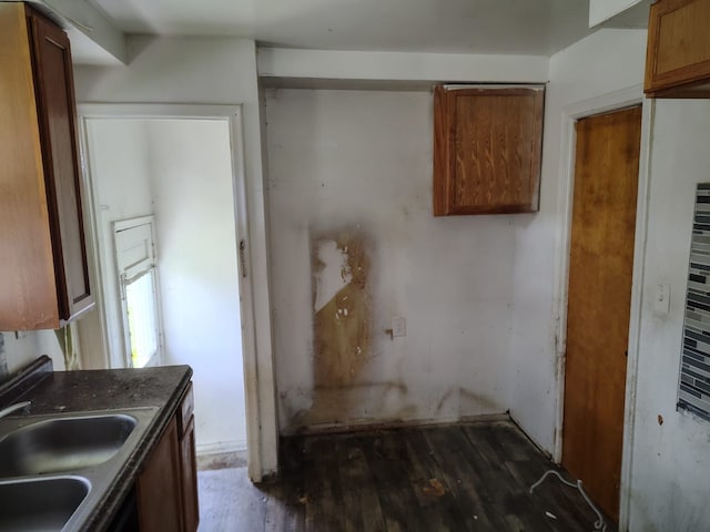 18401 Justine St, Detroit, MI 48234 - kitchen featuring a sink, brown cabinets, and wood finished floors