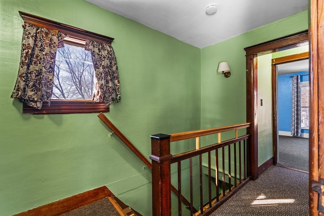 stairway featuring baseboards