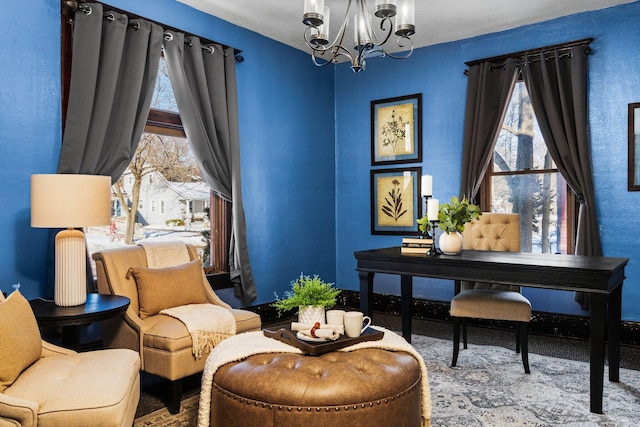 sitting room with a chandelier and a healthy amount of sunlight