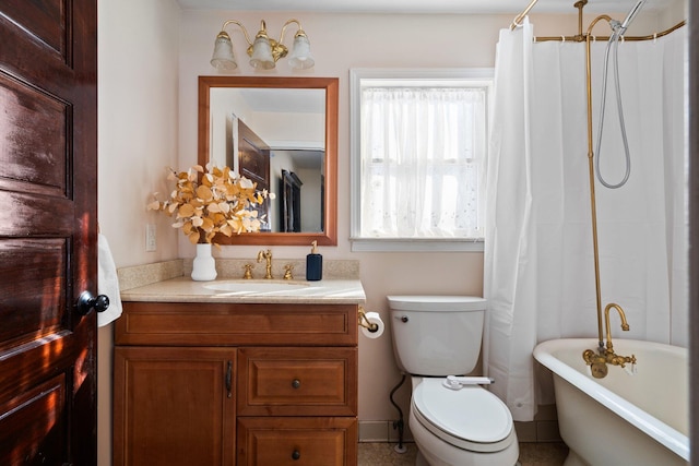 full bathroom with a bathtub, vanity, and toilet