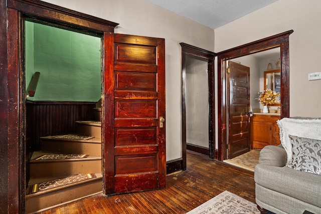 interior space featuring baseboards and wood finished floors