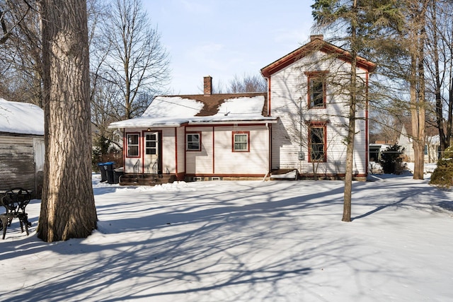 view of front of home with a chimney