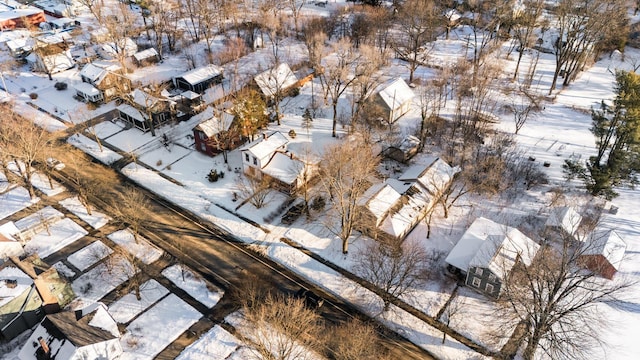 snowy aerial view featuring a residential view