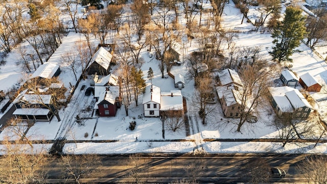 snowy aerial view featuring a residential view