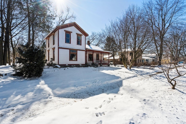 view of front of home featuring a garage and a porch