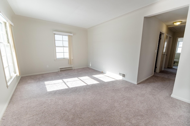 18953 Woodcrest St, Harper Woods, MI 48225 - empty room with light carpet, attic access, visible vents, and baseboards